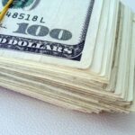 Man arrested over alleged use of fake US$100 notes